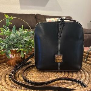 Dooney & Bourke Black bag with White stitching in excellent condition.
